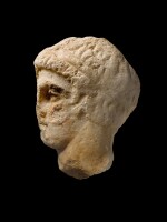 An Attic Marble Relief Head of a Youth, 4th Century B.C.