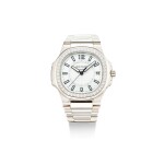 PATEK PHILIPPE | NAUTILUS, REFERENCE 7010, A WHITE GOLD AND DIAMOND-SET BRACELET WATCH WITH DATE, CIRCA 2008