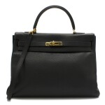 Kelly Retourne 35 Black Colour in Clemence Leather with gold hardware. Hermès. 1995.