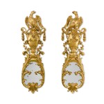 A pair of George II carved giltwood girandole wall mirrors, circa 1740, in the manner of William Kent