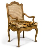 A REGENCE CARVED BEECHWOOD AND CANED FAUTEUIL, Circa 1720