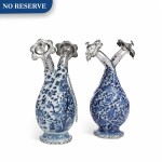 TWO CHINESE BLUE AND WHITE PORCELAIN DOUBLE FLASKS WITH SILVER MOUNTS, THE PORCELAIN EARLY 18TH CENTURY; THE SILVER DUTCH, MID 19TH CENTURY