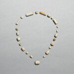 A group of calcified jade beads, Neolithic period, Liangzhu culture | 新石器時代 良渚文化 玉珠管一組