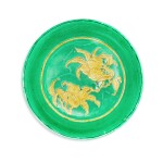A rare green-ground and yellow biscuit-enamelled 'peach' dish,  Ming dynasty, 16th century | 明十六世紀 綠地黃彩刻桃紋盤