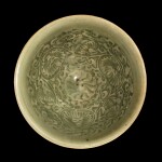 A small moulded Yaozhou celadon 'chrysanthemum' bowl Northern Song dynasty | 北宋 耀州青釉印纏枝菊花紋撇口笠式盌