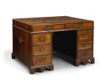 A GEORGE II MAHOGANY CADDY-TOP DOUBLE-SIDED PEDESTAL DESK, MID-18TH CENTURY