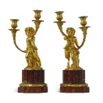 A PAIR OF LOUIS XVI STYLE GILT-BRONZE AND ROUGE GRIOTTE MARBLE TWO-LIGHT CANDELABRA, IN THE MANNER OF CLODION AND LOUIS-FÉLIX DE LA RUE, CIRCA 1880