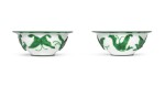 A PAIR OF GREEN-OVERLAY WHITE GLASS BOWLS | QING DYNASTY, 19TH CENTURY [TWO ITEMS]