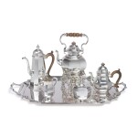 A FOUR-PIECE ENGLISH SILVER TEA AND COFFEE SET WITH SIMILAR TRAY, JAMES ROBINSON AND ROBERT STEWART, LONDON, 1985 AND 1921
