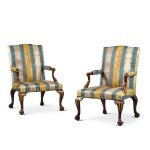 A pair of George II carved mahogany and parcel-gilt library armchairs, mid-18th century, attributed to Paul Saunders