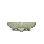 A large ‘Longquan’ celadon-glazed tripod bowl, Ming dynasty | 明 龍泉窰青釉刻花卉紋三足爐