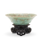 A Longquan celadon lobed crackled dish Song dynasty | 宋 龍泉官窰六瓣葵花式小盤