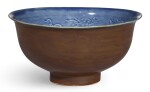 A FINE AND EXTREMELY RARE IMPERIAL BLUE AND BROWN GLAZED ‘DRAGON’ BOWL MING DYNASTY, HONGWU PERIOD | 明洪武 御製外醬釉內藍釉暗花雲龍紋盌