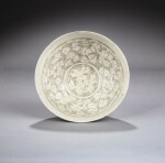 A large 'Cizhou' white-glazed sgraffiato ‘peony’ bowl, Northern Song dynasty | 北宋 磁州窰白釉剔纏枝牡丹紋大盌