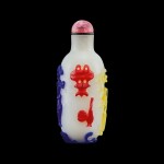 A five-colour overlay white glass 'Hundred Antiques' snuff bottle Qing dynasty, 18th - 19th century | 清十八至十九世紀 涅白地套五色料清供圖鼻煙壺