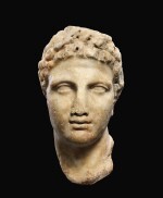 A GREEK MARBLE HEAD OF A YOUTH, CIRCA MID 4TH CENTURY B.C.