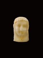 A South Arabian Alabaster Relief Head of a Man, Qataban, 3rd Century B.C./1st Century A.D.