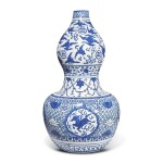 A large blue and white 'mythical beast' double-gourd vase, Ming dynasty, Jiajing period | 明嘉靖 青花開光瑞獸雲鶴八卦紋大葫蘆瓶