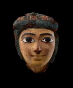 An Egyptian Polychrome Wood Mummy Mask, 21st/22nd Dynasty, 1075-716 B.C.