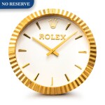 Rolex | Manufactured by Inducta, A gilt brass wall clock, Circa 2010 | 勞力士，由 INDUCTA 製作 | 鍍金銅製掛鐘，約2010年製