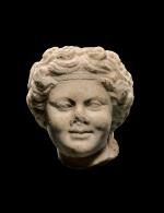  A ROMAN MARBLE HEAD OF DIONYSOS AS A BOY, 1ST/2ND CENTURY A.D.