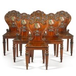 A set of six George IV carved mahogany hall chairs, circa 1822, in the manner of Gillows