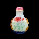 A four-colour overlay glass 'phoenix and flower' snuff bottle, Qing dynasty, 19th century | 清十九世紀 半透明地套四色料鳳凰牡丹紋鼻煙壺