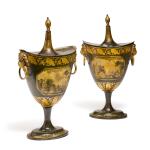 A pair of parcel-gilt and green painted tôle chestnut urns, probably Pontypool, Wales, 19th century
