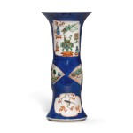A powder-blue-ground famille-verte beaker vase, Qing dynasty, 19th century | 清十九世紀 灑藍地五彩開光山水花鳥博古圖花觚