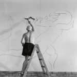 EDWARD QUINN  |  'PABLO PICASSO WORKING ON THE "WAR AND PEACE STUDY" DRAWINGS ON THE WALL OF CHAPELLE DE LA PAIX (OR TEMPLE DE LA PAIX) FOR THE DOCUMENTARY FILM OF LUCIANO EMMER, VALLAURIS', 1953
