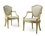 A pair of George III giltwood shield-back armchairs, circa 1780, manner of Gillows