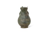 An archaic bronze ritual wine vessel and cover, hu Spring and Autumn period 春秋　青銅蓋壺