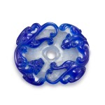A blue overlay glass 'chilong and bi disc' pendant, Qing dynasty, 19th century 清十九世紀 珍珠地套藍料雙螭龍紋璧