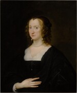 Portrait of an elegant woman, half length, in a black dress with pearls