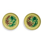 A PAIR OF GREEN AND AUBERGINE-ENAMELED YELLOW-GROUND 'DRAGON' DISHES,  KANGXI MARKS AND PERIOD