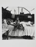  DAVID GOLDBLATT | A FAMILY IN THEIR SHELTER AT KTC SQUATTER CAMP, CAPE TOWN, 1984   