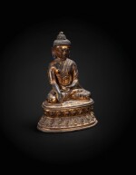 A gilt copper alloy seated Buddha Tibet, 14th century | 西藏 十四世紀 鎏金銅合金佛坐像