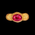 A gold and red-gem repoussé ring Champa, 14th century | 十四世紀 占城 金嵌紅色寶石戒指