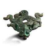 An archaic bronze 'mythical beast' stand Eastern Zhou dynasty | 東周 青銅盦龍找金錢座