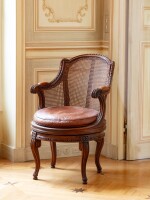 A Louis XVI walnut fauteuil de bureau à assise tournante, circa 1780, attributed to Georges Jacob | Fauteuil de bureau à assise tournante en noyer d'époque Louis XVI, vers 1780, attribué à Georges Jacob