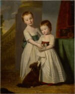 Portrait of a young boy and girl with their dog and puppy