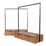 A pair of black lacquered metal and standing coat racks