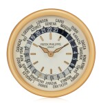 A large gilt brass wall clock with world time dial, Circa 2000 百達翡麗 大型鍍金銅掛鐘，配世界時間錶盤，約2000年製