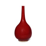 A copper-red-glazed bottle vase, Qing dynasty, 18th / 19th century | 清十八 / 十九世紀 紅釉長頸瓶