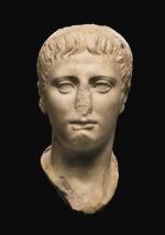A ROMAN MARBLE PORTRAIT HEAD OF A YOUTH, JULIO-CLAUDIAN, EARLY 1ST CENTURY A.D.