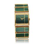 Reference 7152 'Khanjar' | A yellow gold, malachite and diamond-set bracelet watch with a matching pair of ear clips, pendant with chain, and ring, Circa 1970