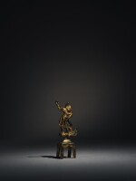 A gilt-bronze figure of Dvarapala Tang dynasty | 唐 鎏金銅力士立像