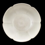 A Dingyao white-glazed lobed dish 10th century | 十世紀 定窰白釉葵式盤