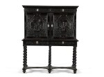 A Louis XIII silver-mounted carved ebony and ebonised cabinet-on-stand, Paris, second quarter 17th century, the stand partly later