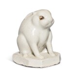 A white-glazed stoneware figure of a seated hare, Tang dynasty | 唐 白釉坐兔